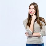 beautiful-young-woman-thinking-white-background_1301-7745