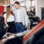 family-with-little-son-car-salon_1157-21748