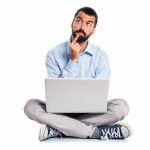 man-with-laptop-thinking_1368-5024