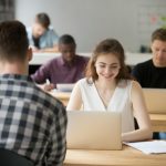 young-smiling-woman-working-laptop-coworking-office-space_1163-3934