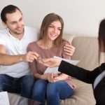 beautiful-couple-property-owners-getting-keys-from-real-estate-agent_1163-4182